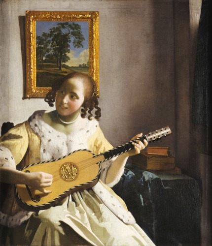 기타를 연주하는 젊은 여인